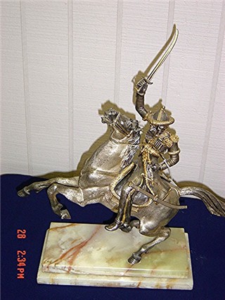 Silverplate man on horse