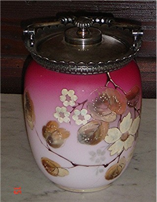 Webb peachblow cracker jar, decorated with cascading white and brown stemmed flowers circa 1900